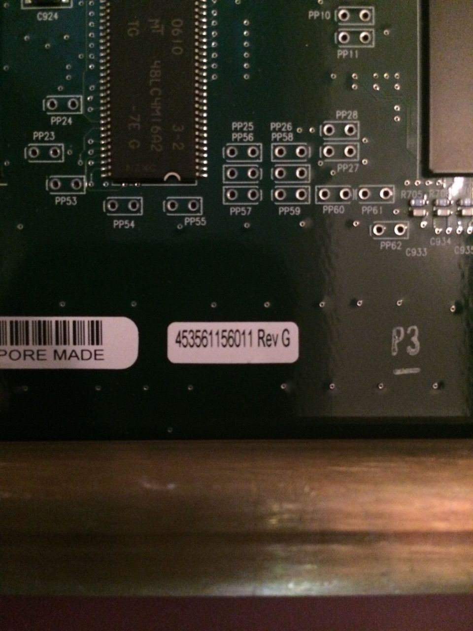 a close up of a computer board with a bar code on it