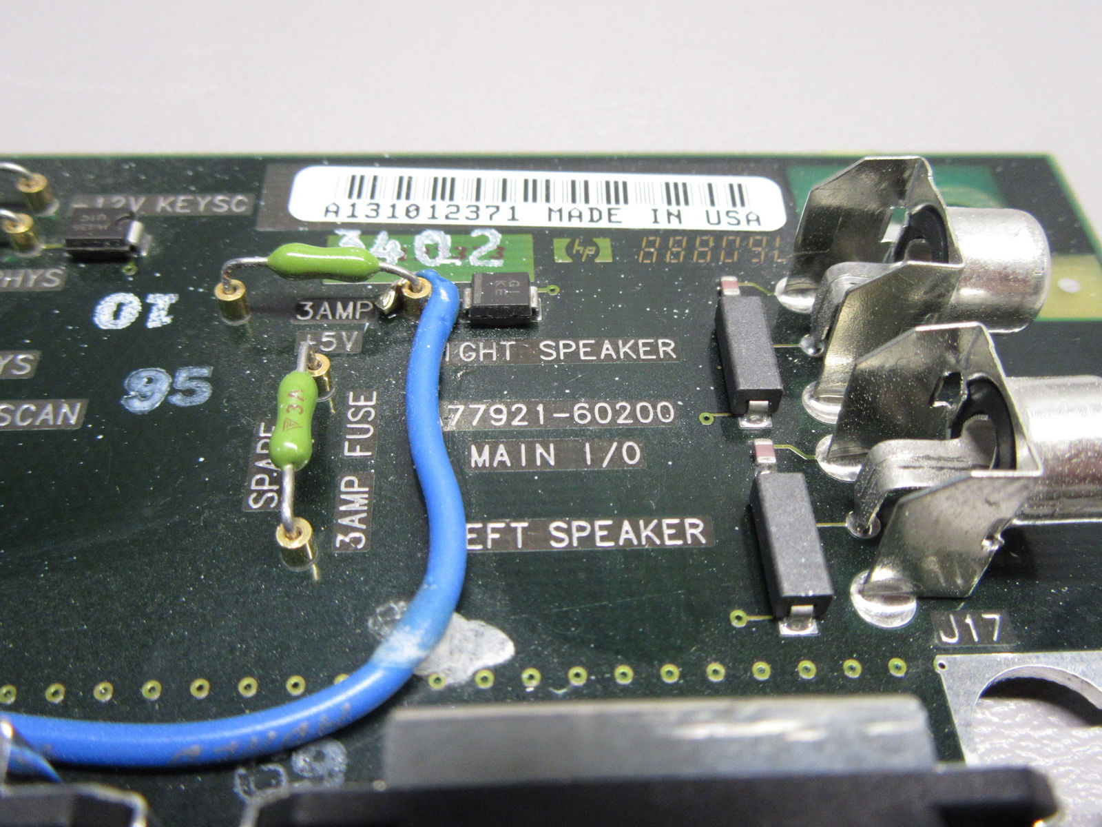 a close up of a circuit board with wires connected to it
